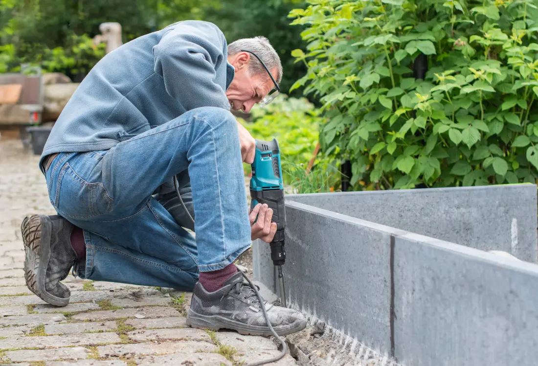A contractor performing concrete repair work