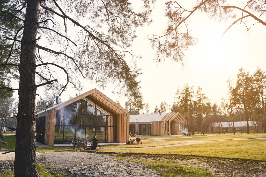 A modern home exterior surrounded by trees