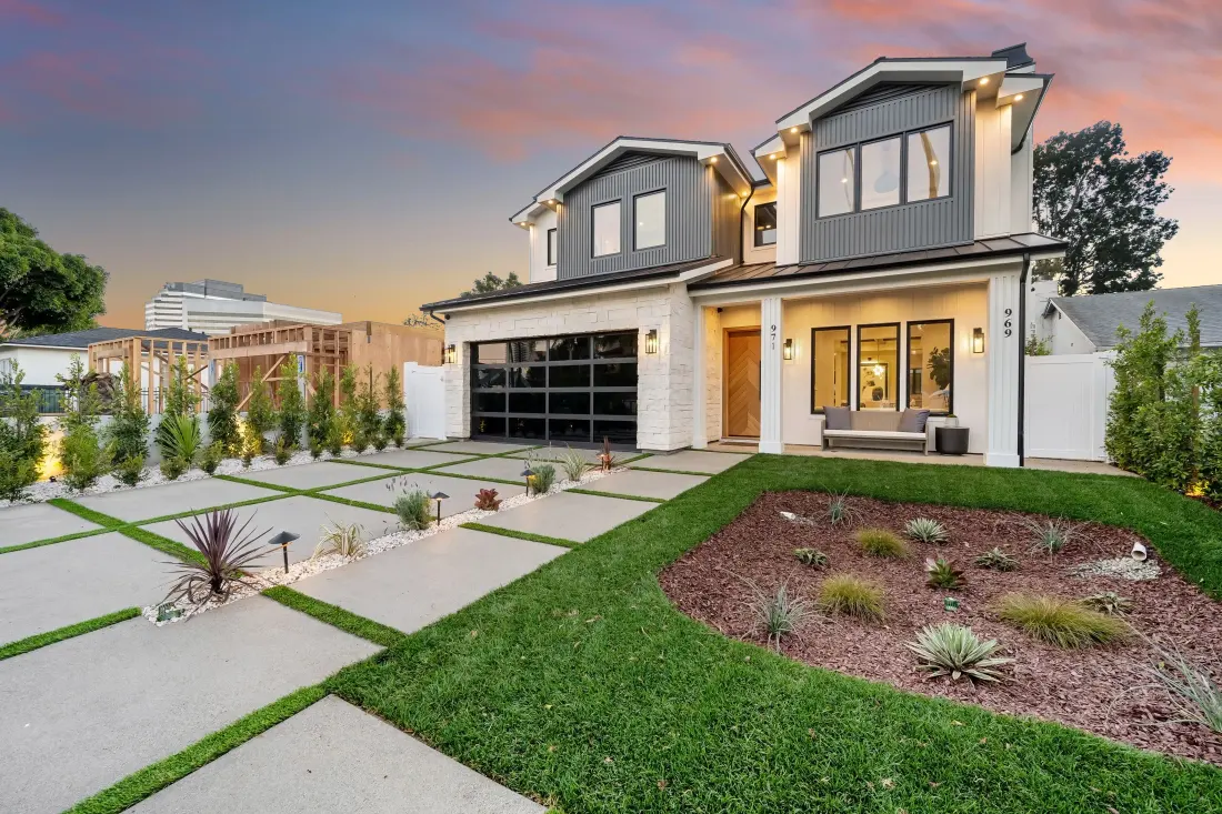 A new residential construction project alongside a finished home