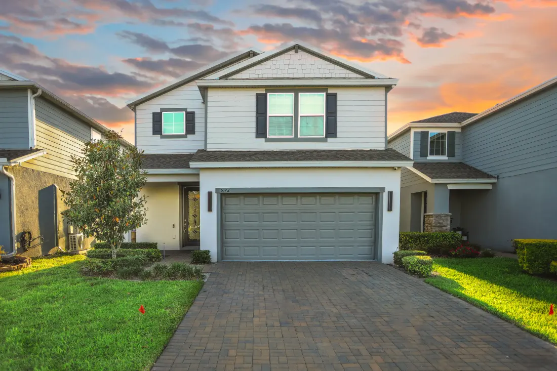 A two-story home at dusk